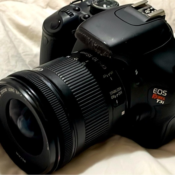 Nice camera.It is EOS Rebel T31 with extended lens Unfortunately missing battery - Picture 1 of 5